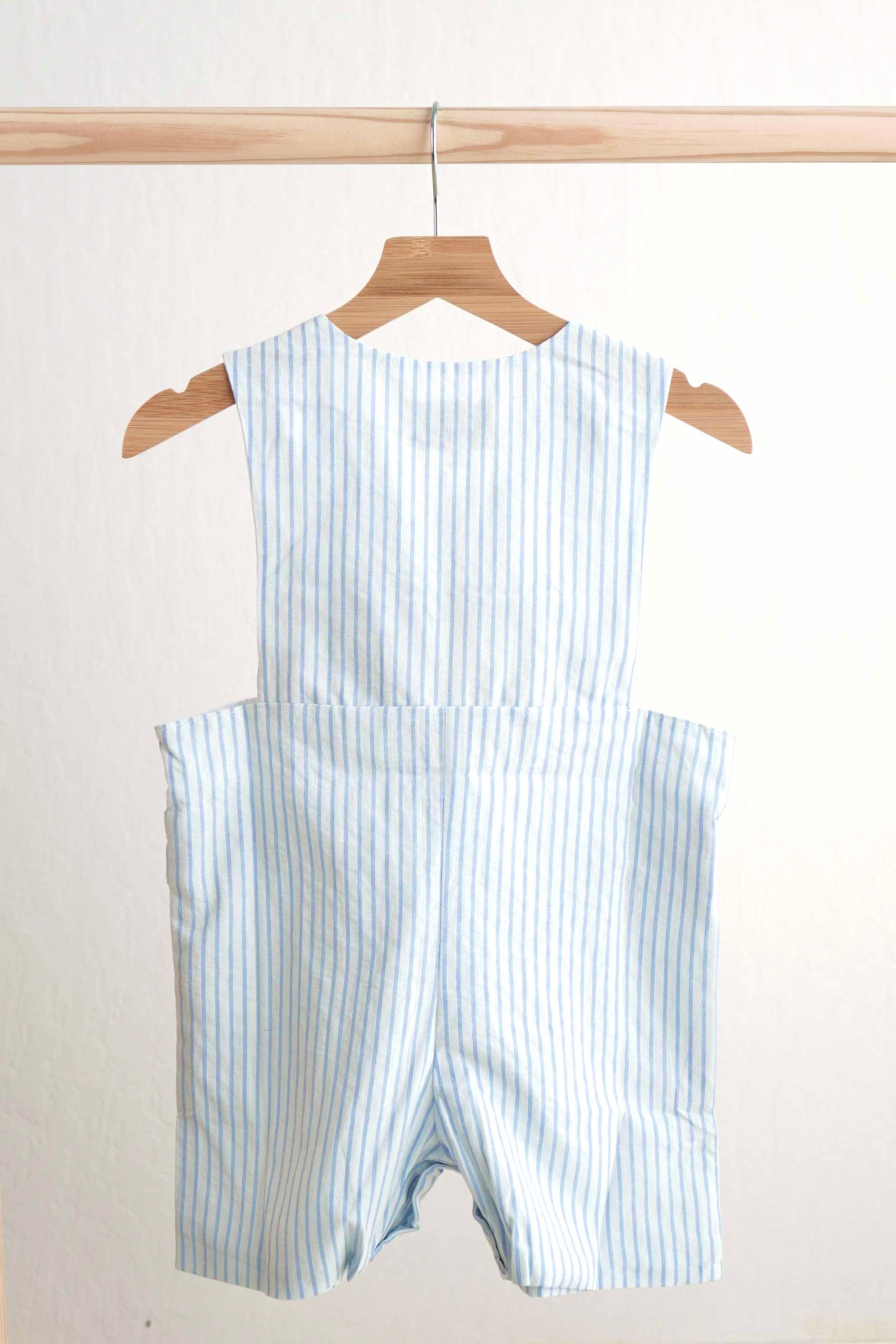 Blue Easter bunny hand-smocked jonjon with playful bunny pattern for boys.
