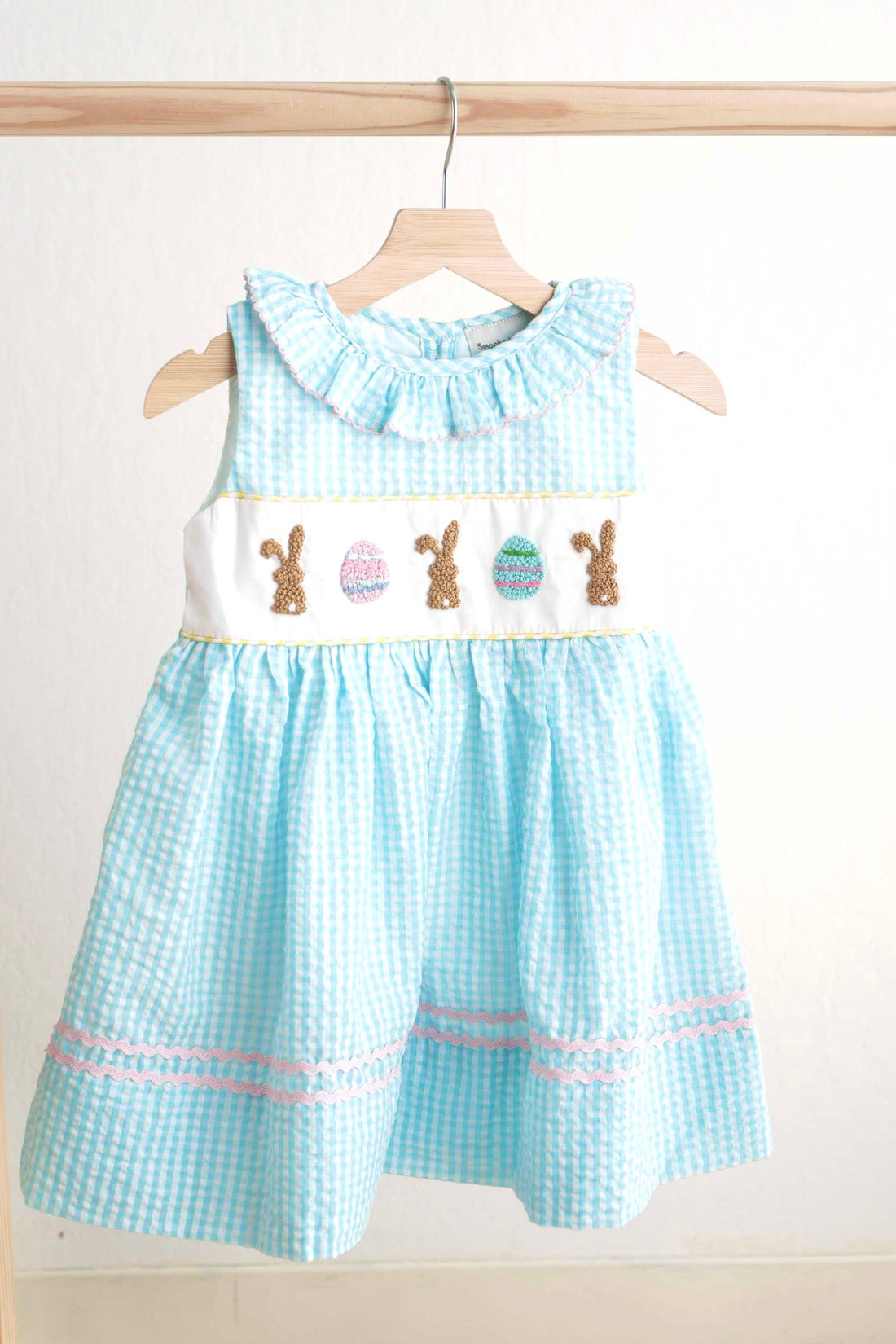 Blue gingham seersucker dress with Easter bunny and egg French knot design.
