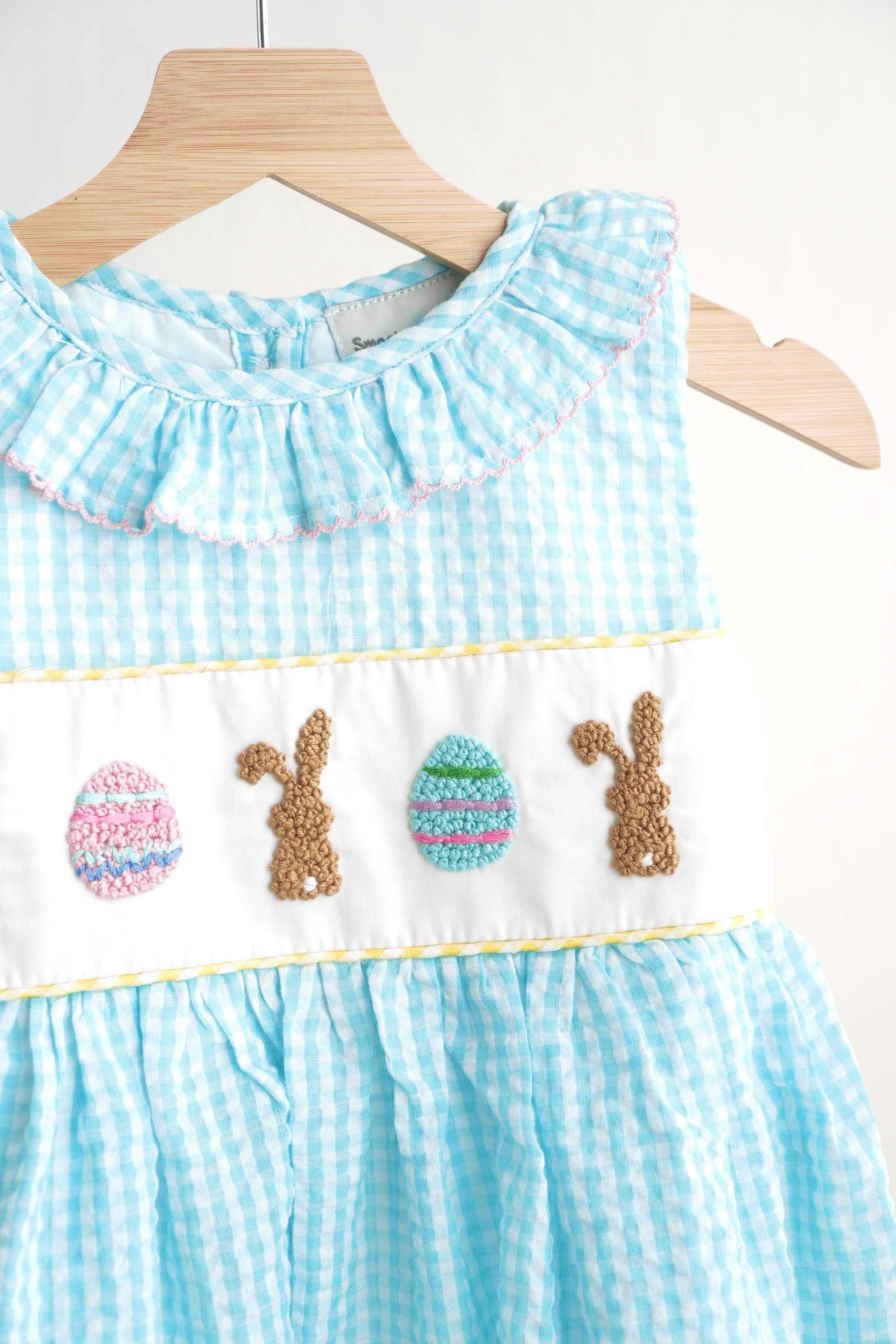 Blue gingham seersucker dress with Easter bunny and egg French knot design.
