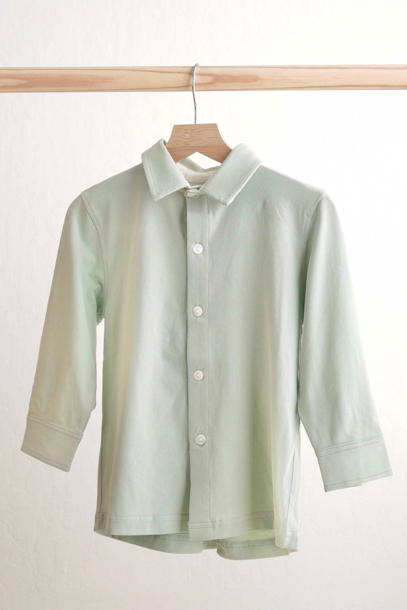 Sage green button-down shirt for boys, perfect for casual or formal occasions.