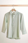 Sage green button-down shirt for boys, perfect for casual or formal occasions.