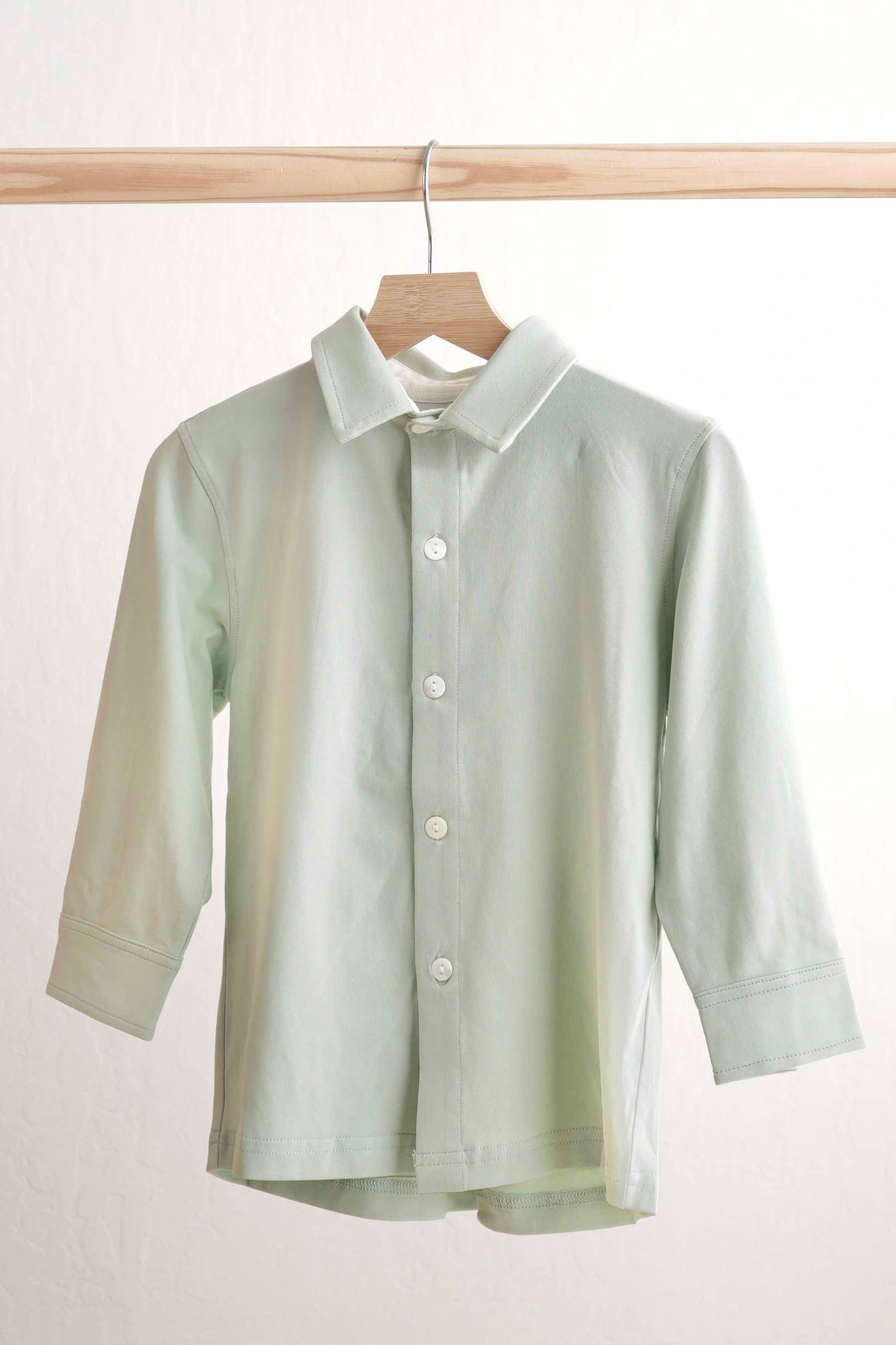 Sage green button-down shirt for boys, perfect for casual or formal occasions.