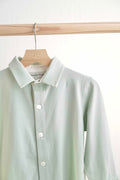 Sage green button-down shirt for boys, perfect for casual or formal occasions.