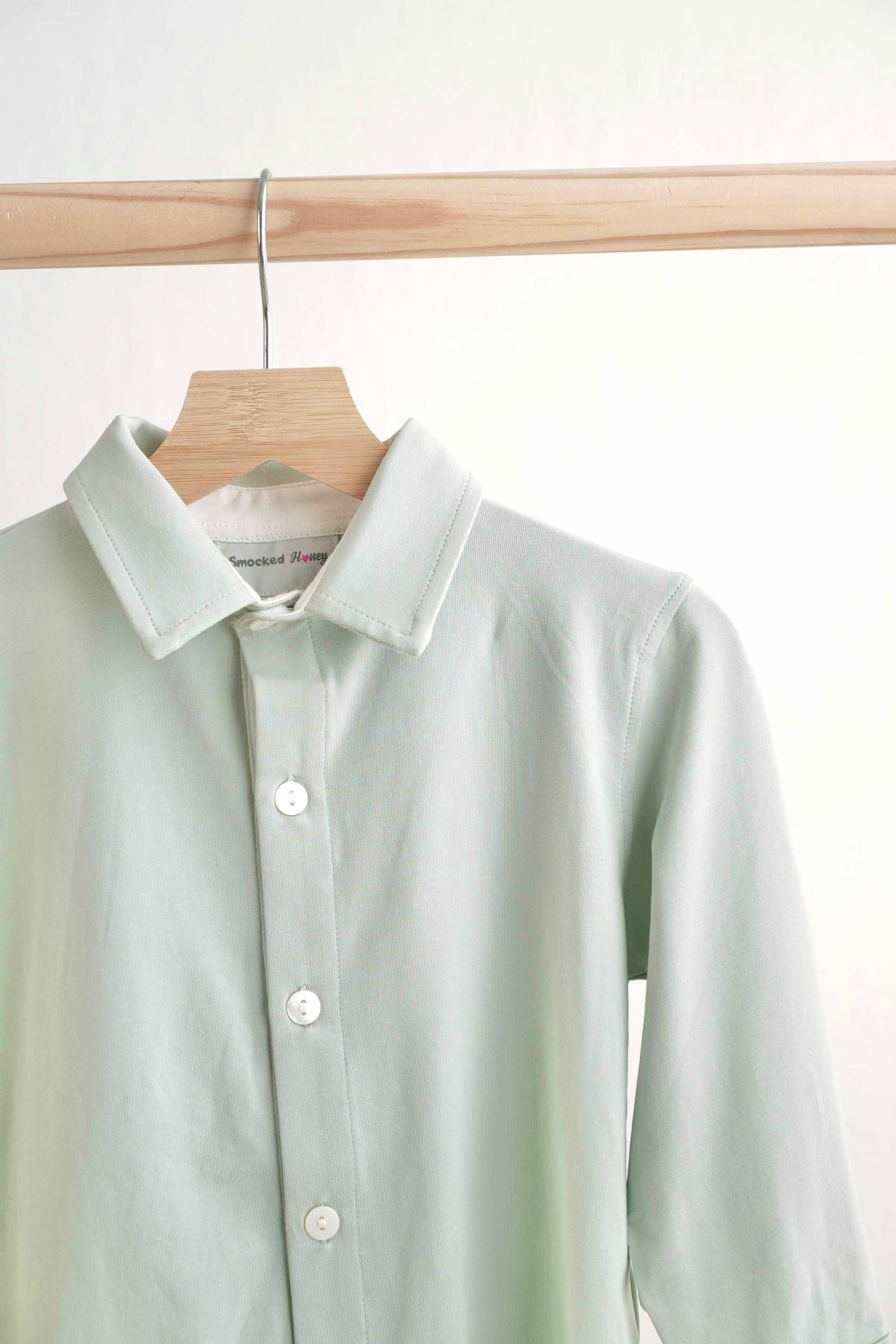 Sage green button-down shirt for boys, perfect for casual or formal occasions.
