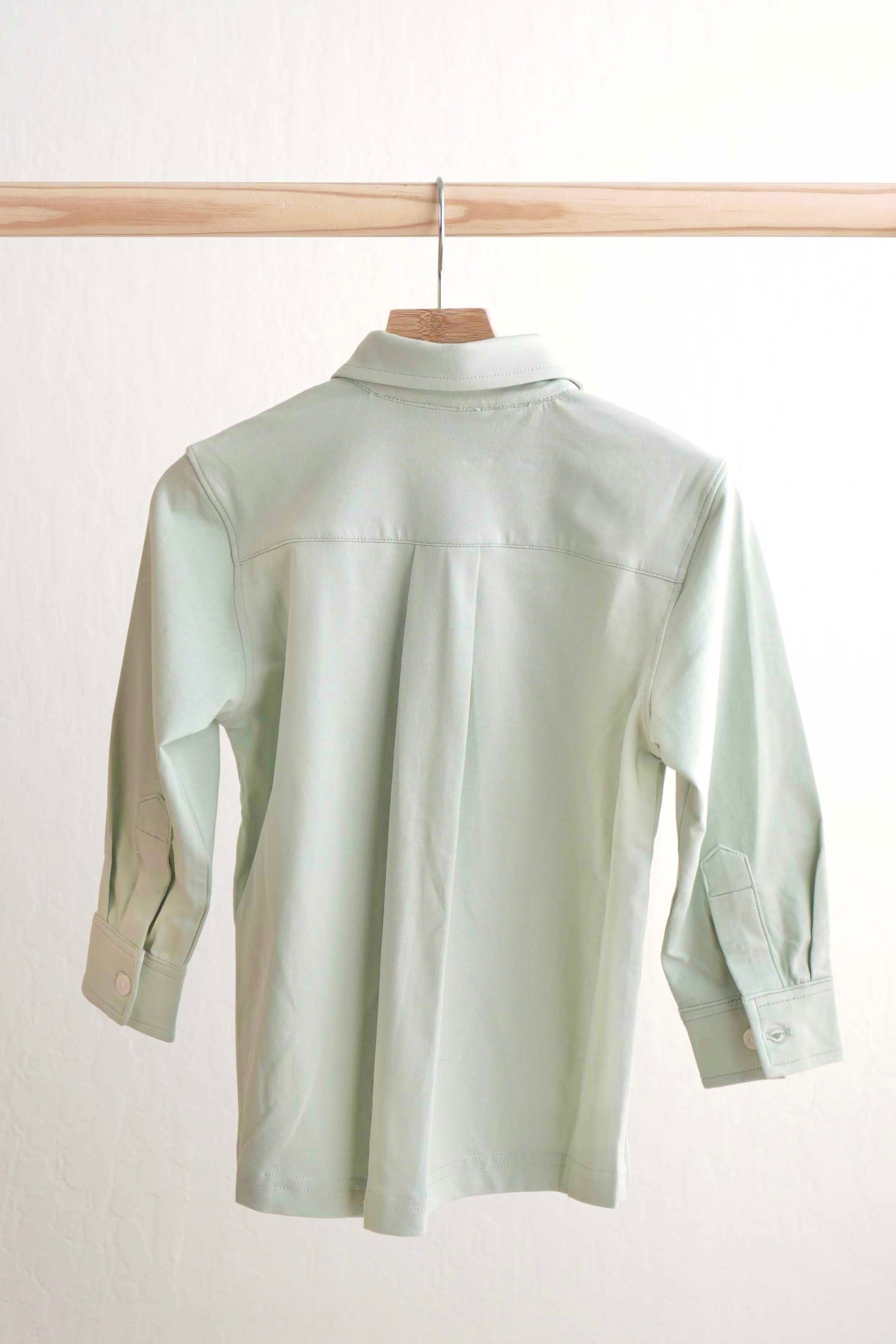 Sage green button-down shirt for boys, perfect for casual or formal occasions.