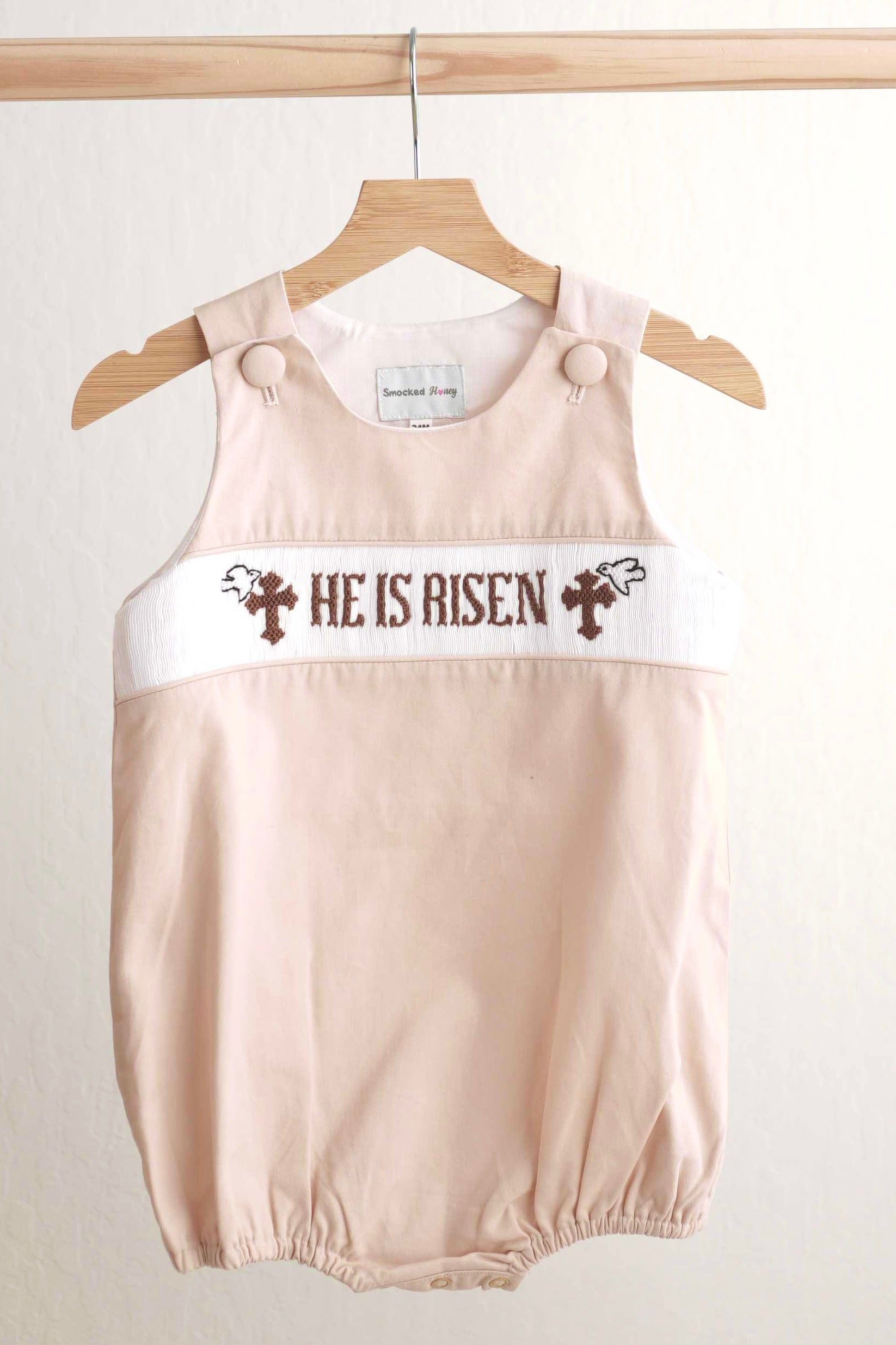 Khaki hand-smocked boy bubble with "He is Risen" Easter embroidery.