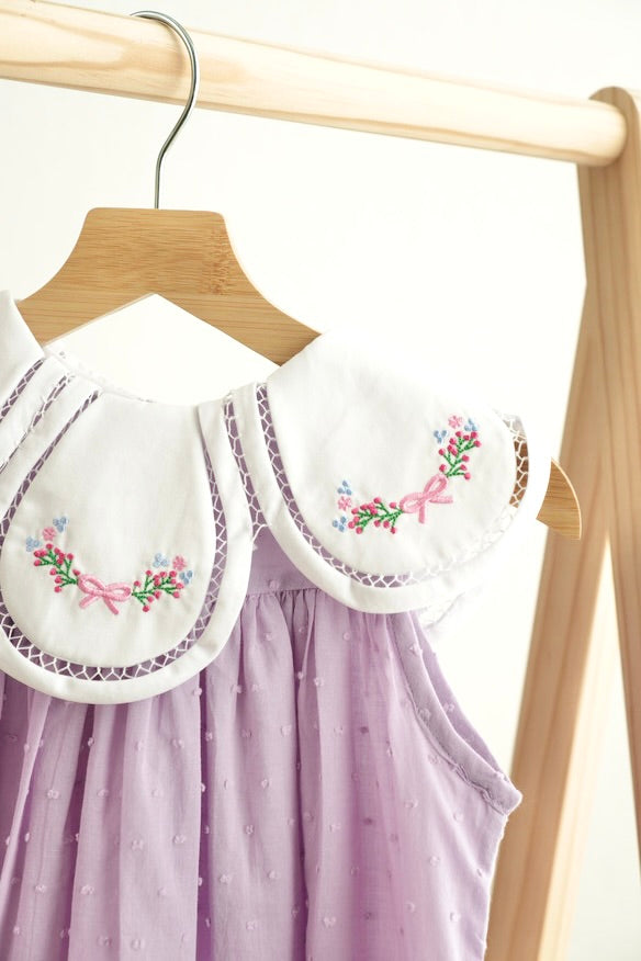 Lavender floral dress with bow embroidery and swiss dot pattern for girls.