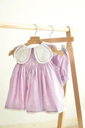 Lavender floral embroidered girl bloomer set with Swiss dots and bow detail.