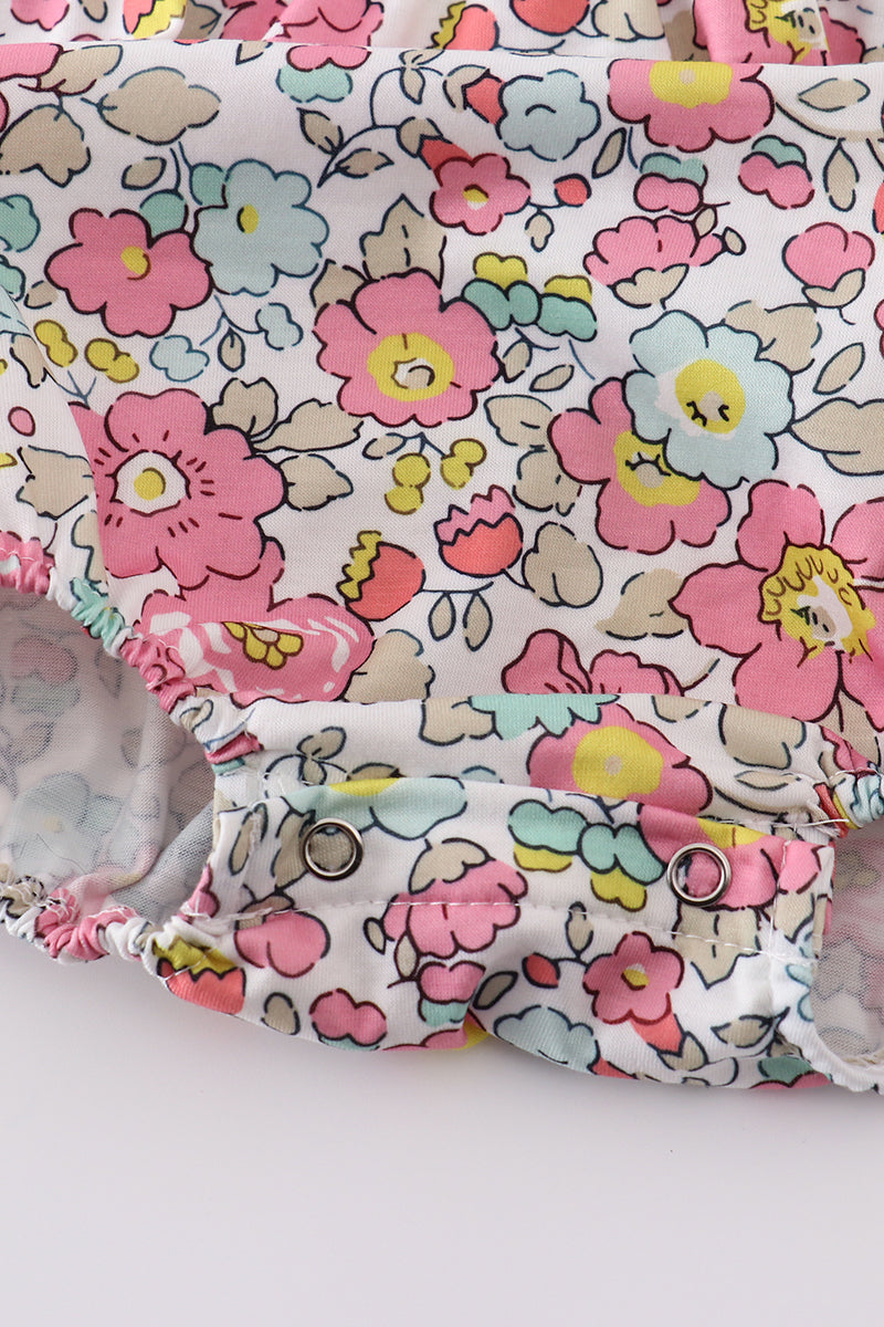 Pink floral print bubble romper with ruffled sleeves, perfect for spring outings.