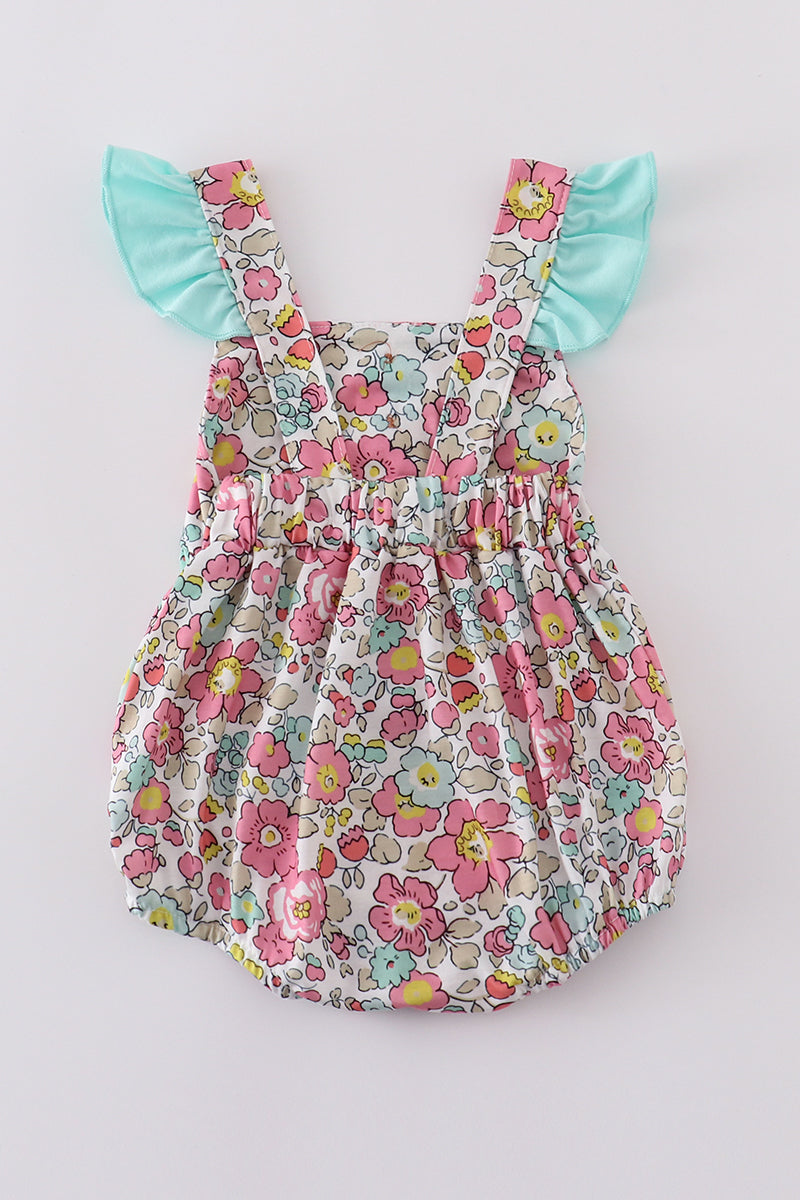 Pink floral print bubble romper with ruffled sleeves, perfect for spring outings.