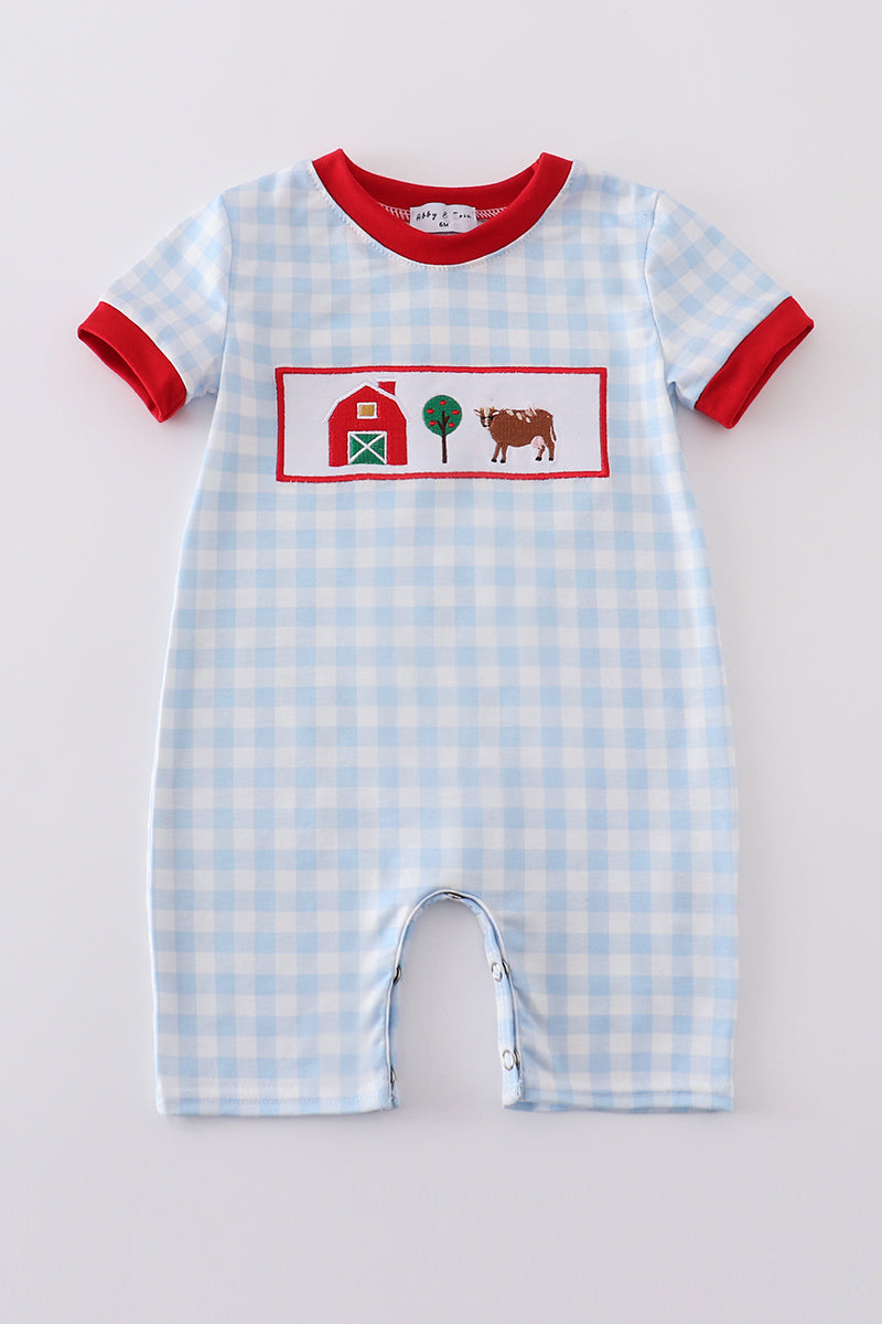 Blue farm embroidery romper featuring playful barnyard animals and cozy cotton fabric.