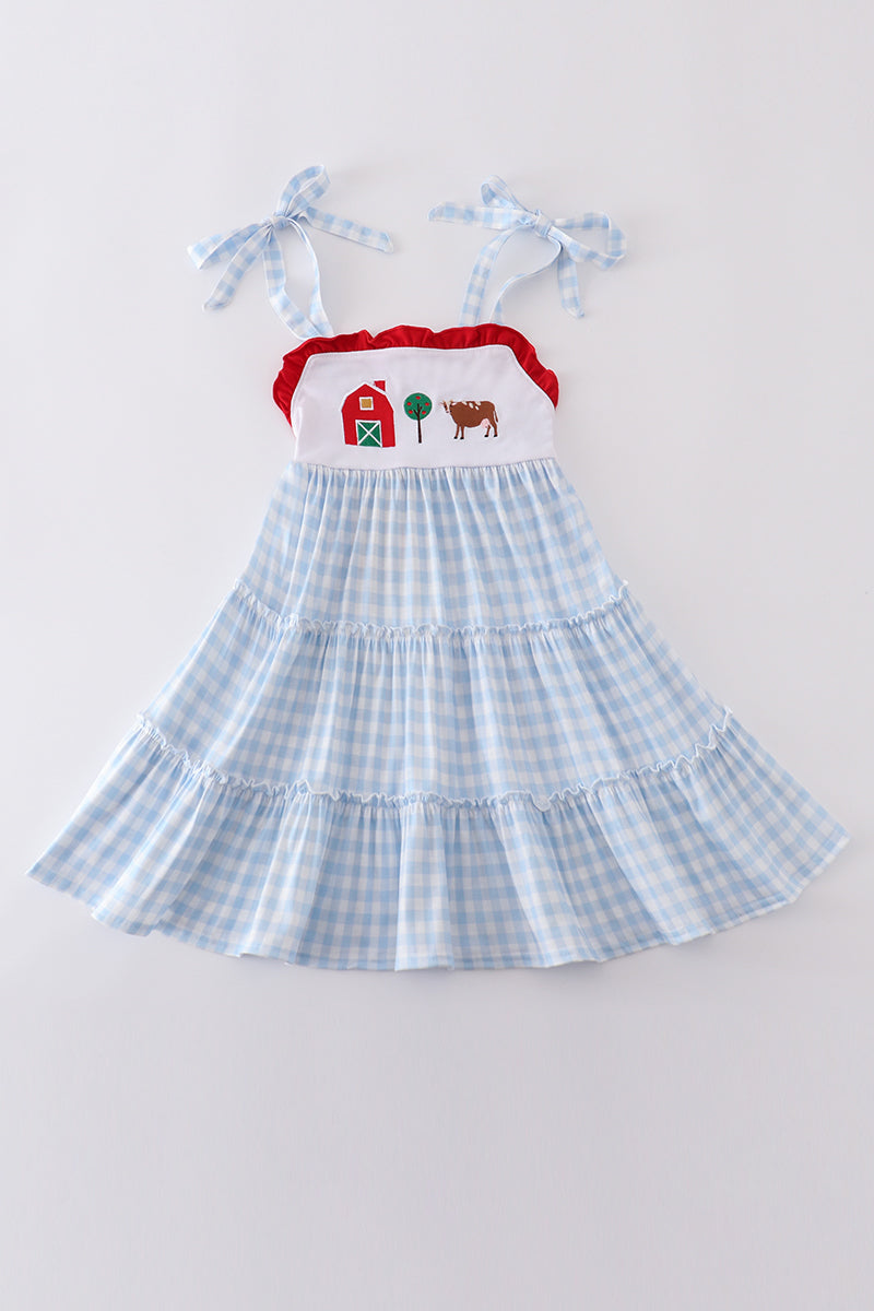 A charming blue tiered dress with playful farm-themed embroidery, perfect for kids.