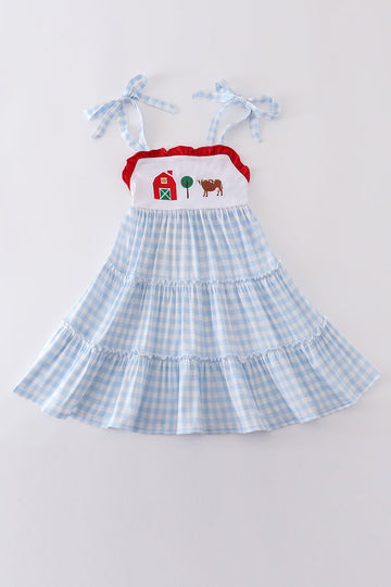 A charming blue tiered dress with playful farm-themed embroidery, perfect for kids.