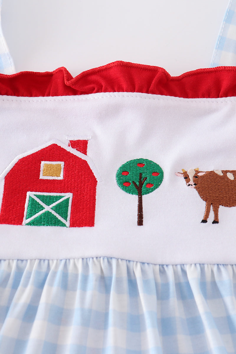 A charming blue tiered dress with playful farm-themed embroidery, perfect for kids.