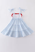 A charming blue tiered dress with playful farm-themed embroidery, perfect for kids.