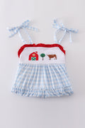 A charming blue tiered dress with playful farm-themed embroidery, perfect for kids.