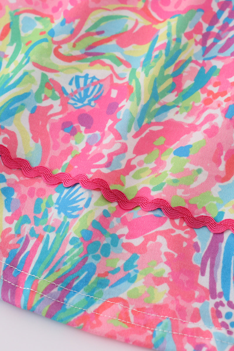 Bright neon reef MAMA'S embroidery dress with playful ocean-themed patterns.