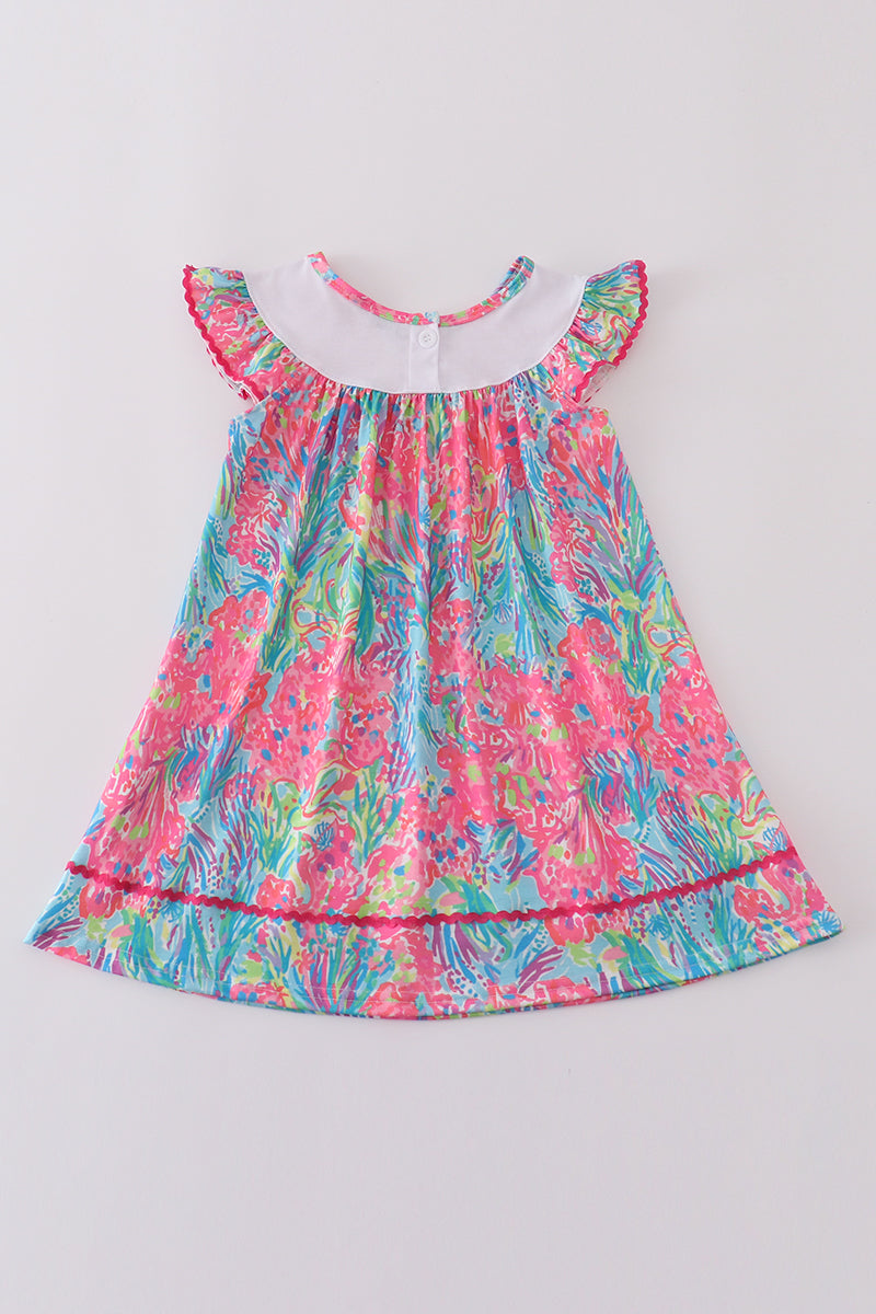 Bright neon reef MAMA'S embroidery dress with playful ocean-themed patterns.