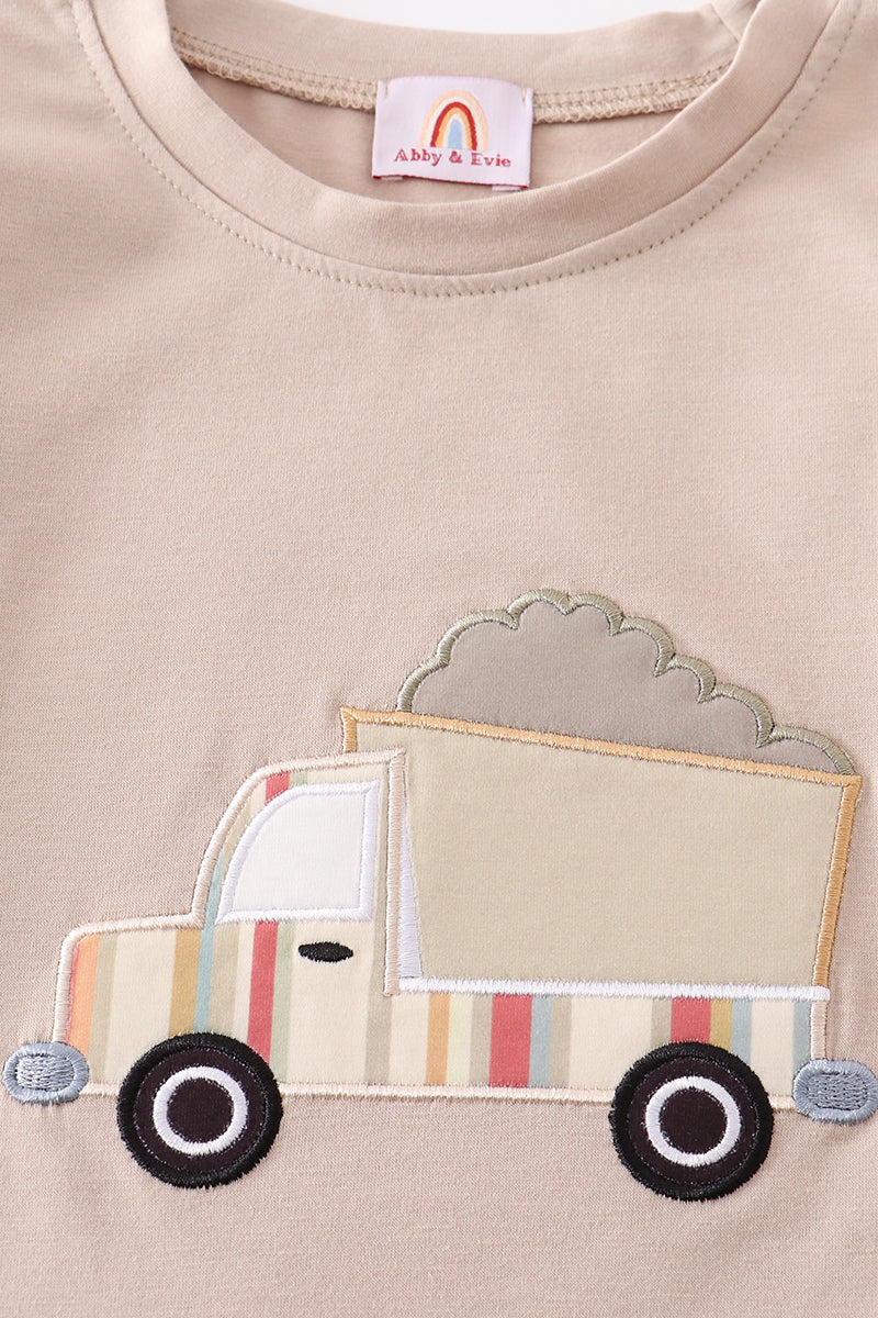 Khaki long-sleeve top with colorful truck applique, perfect for playful adventures.