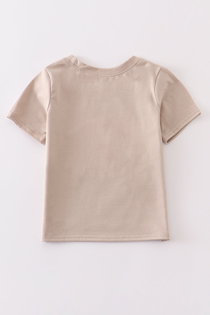 Khaki long-sleeve top with colorful truck applique, perfect for playful adventures.