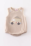 Khaki bubble romper with a cheerful truck applique, perfect for playtime.