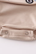 Khaki bubble romper with a cheerful truck applique, perfect for playtime.