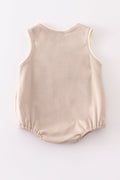 Khaki bubble romper with a cheerful truck applique, perfect for playtime.