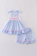 Blue seersucker set with adorable whale embroidery, perfect for summer adventures.