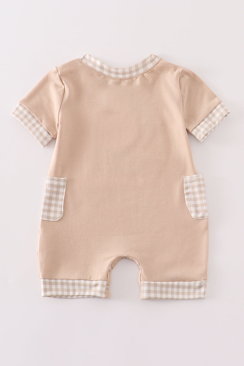 A cozy, blue romper with "Daddy's Hunting Buddy" embroidered in playful font.