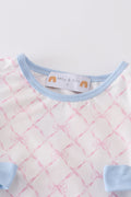 A cute pink bow shorts set for girls, perfect for playful summer days.
