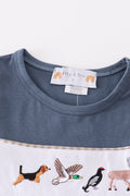 Navy dress with playful hunting embroidery, perfect for adventurous little ones.