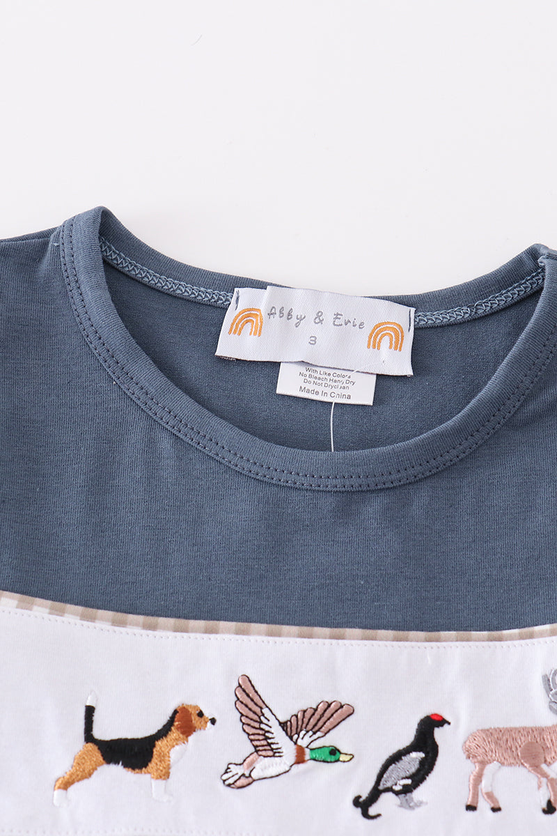 Navy dress with playful hunting embroidery, perfect for adventurous little ones.