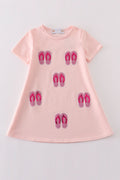 Matching pink sequin dresses with slippers, perfect for mom and daughter twinning.
