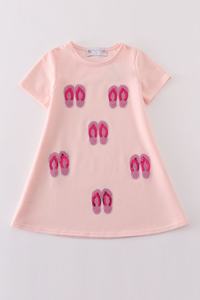 Matching pink sequin dresses with slippers, perfect for mom and daughter twinning.