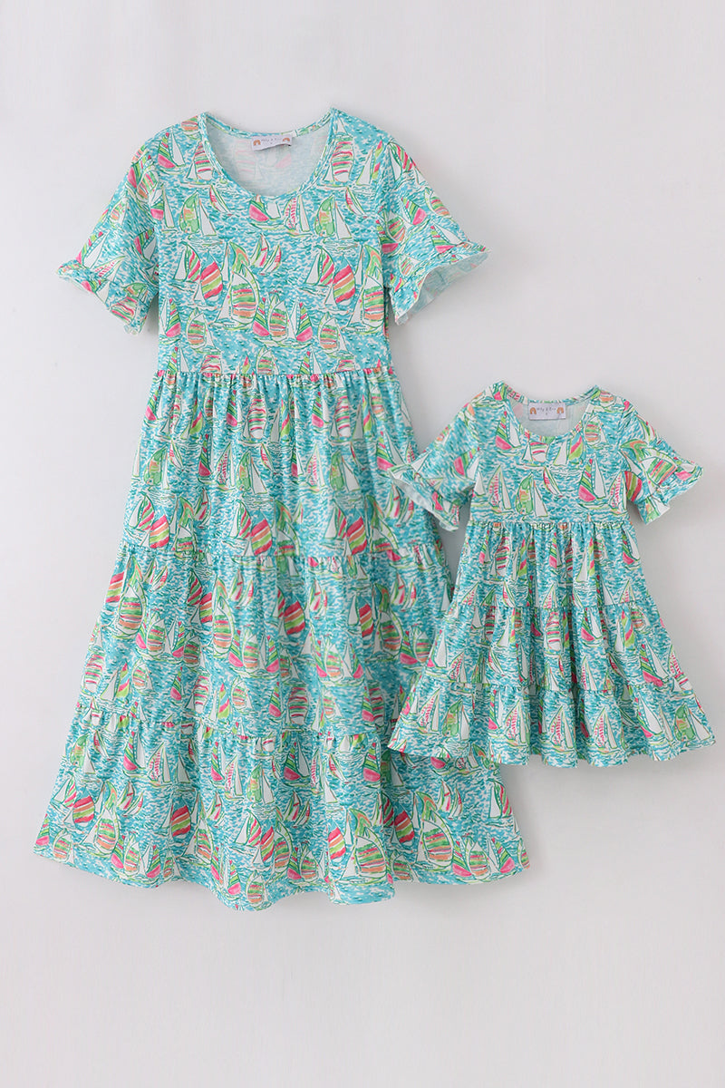 Teal tiered dress with sailboat print, perfect for matching mom and me outfits.