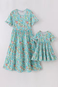 Teal tiered dress with sailboat print, perfect for matching mom and me outfits.