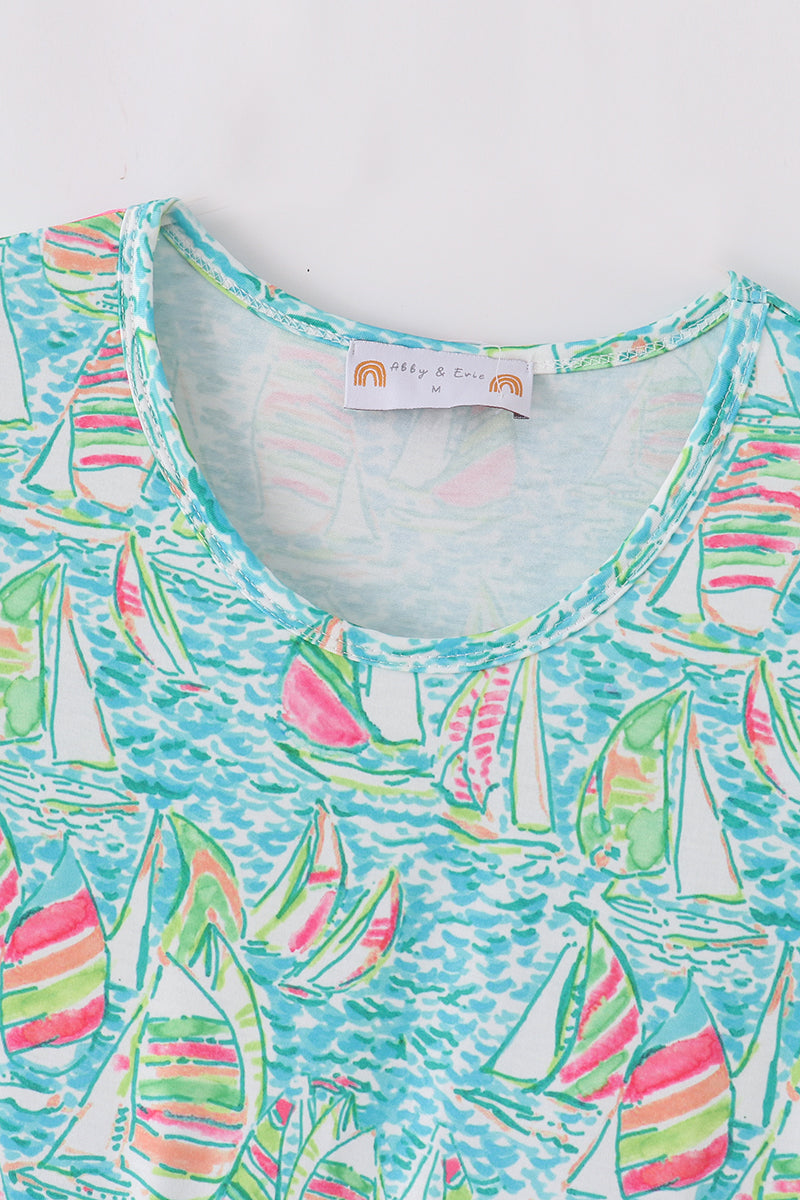 Teal tiered dress with sailboat print, perfect for matching mom and me outfits.