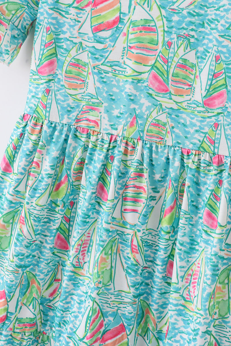 Teal tiered dress with sailboat print, perfect for matching mom and me outfits.