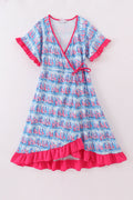 Matching mom and me dresses with playful blue sailboat print, perfect for summer outings.