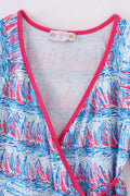 Matching mom and me dresses with playful blue sailboat print, perfect for summer outings.