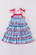 Matching mom and me dresses with playful blue sailboat print, perfect for summer outings.
