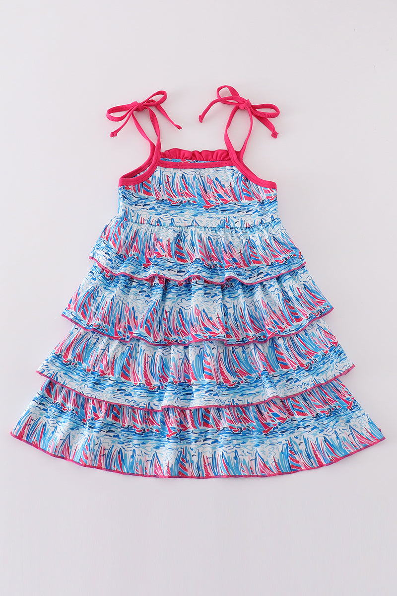 Matching mom and me dresses with playful blue sailboat print, perfect for summer outings.