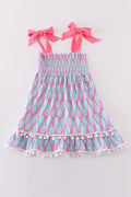 Matching blue smocked dresses with ribbon lace detailing for mom and daughter.