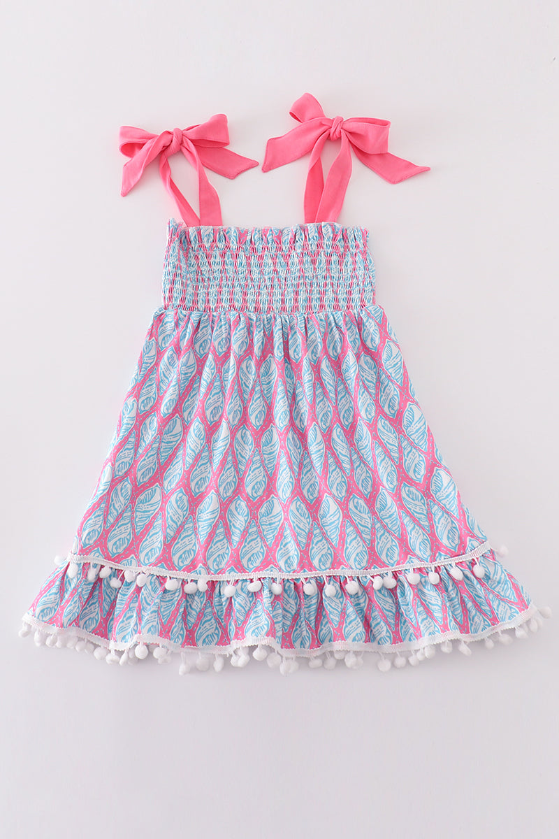 Matching blue smocked dresses with ribbon lace detailing for mom and daughter.