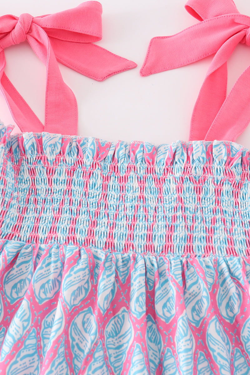 Matching blue smocked dresses with ribbon lace detailing for mom and daughter.