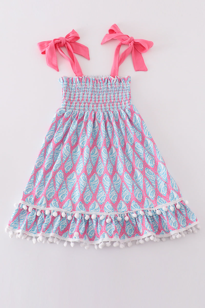 Matching blue smocked dresses with ribbon lace detailing for mom and daughter.