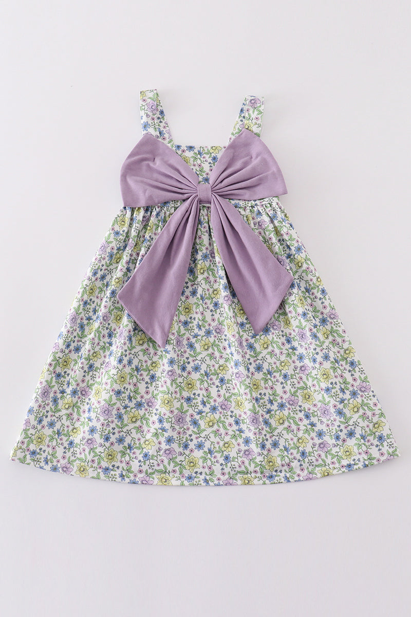 Purple floral girl dress with a bow, perfect for special occasions.