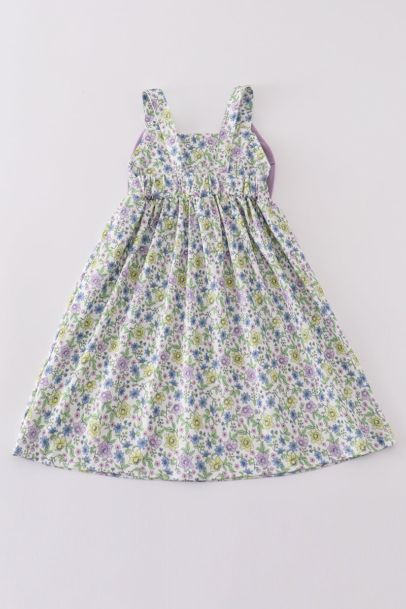 Purple floral girl dress with a bow, perfect for special occasions.