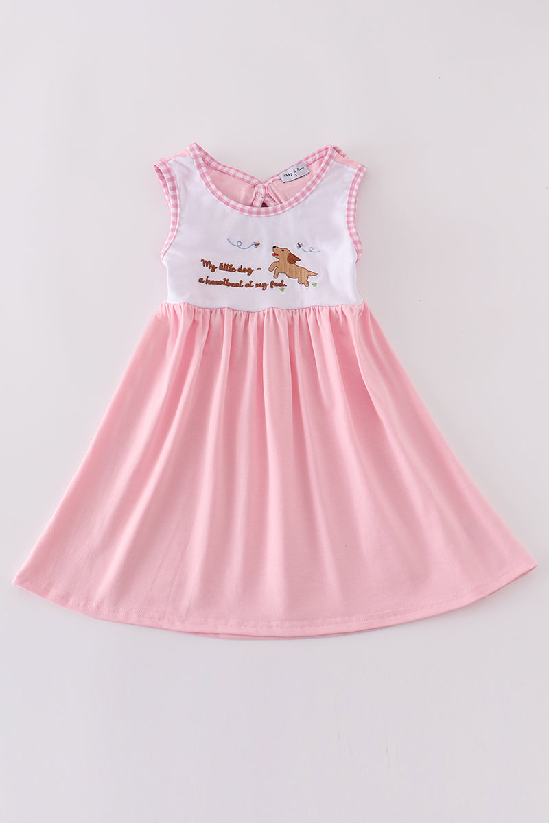 A charming pink dress with adorable puppy embroidery, perfect for little girls.