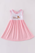 A charming pink dress with adorable puppy embroidery, perfect for little girls.